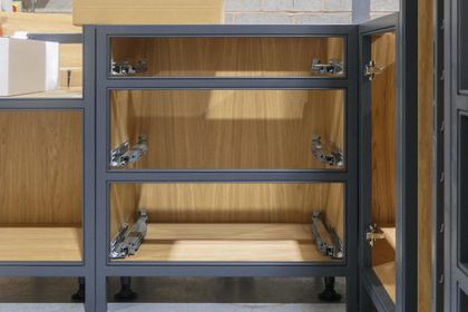 Painted cabinet carcass with oak-veneered interior under construction in the workshop