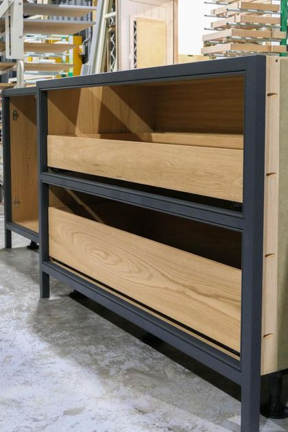 Shaker cabinet frame with oak drawer boxes and soft-close hinges in the workshop