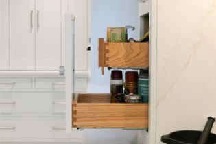 Large pan drawer with dove tail detailing on the joints, secret drawer inside holding different condiments.