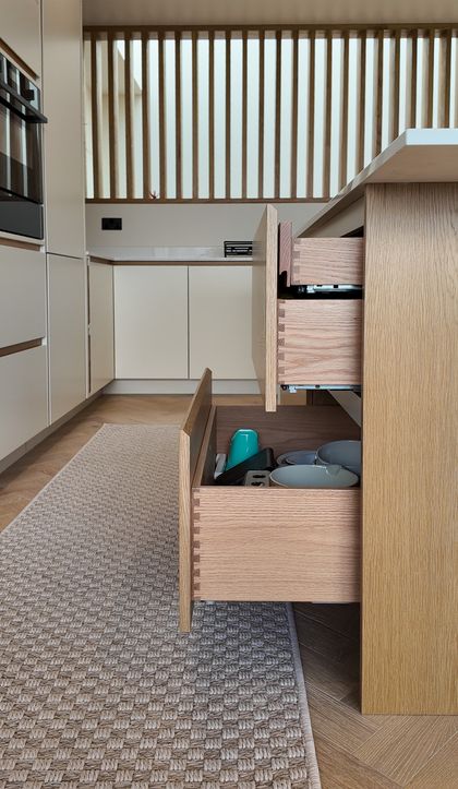 Hidden drawer within a large pan drawer
