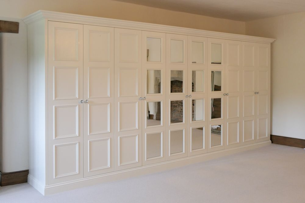 Large white wardrobes with mirrors