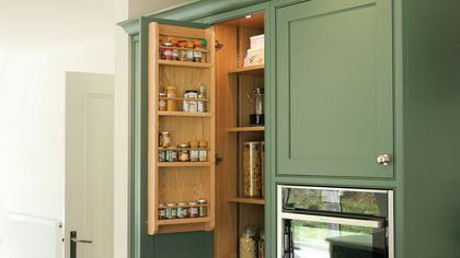 A spice rack fixed to the internal side of a shaker kitchen cabinet door