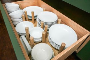White crockery filled peg drawer