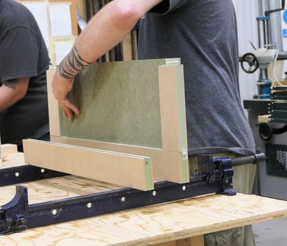 Solid timber cabinet door being made by hand in the Minerva workshop