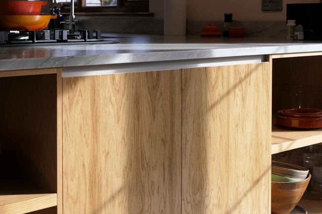 Close up of the oak modern kitchen in the sunlight