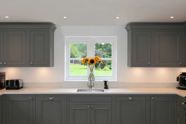 Grey Florence Shaker cabinetry showing the signature bolection moulding