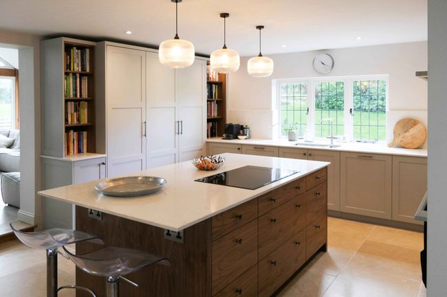 bespoke modern white kitchen with walnut island